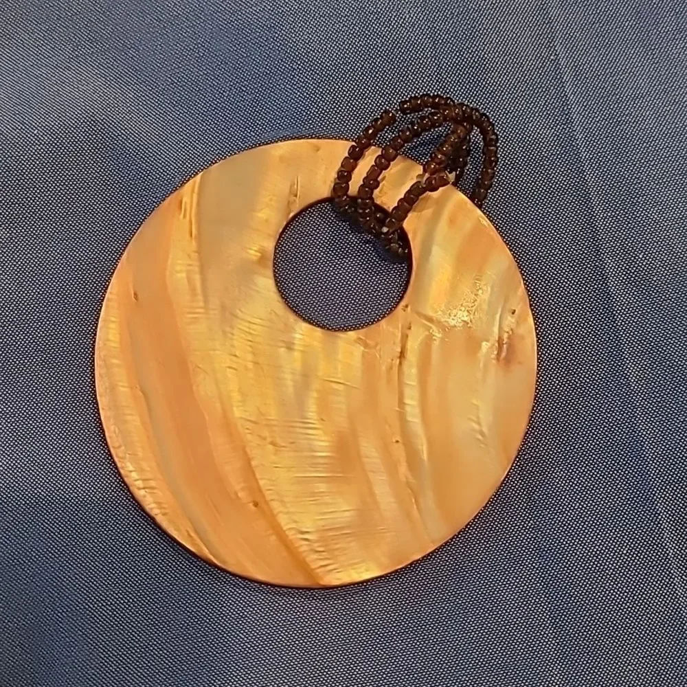 Abalone disc with stranded glass beads